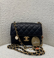 MINI FLAP WITH CHARMS