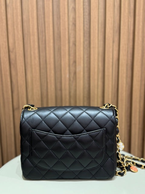 MINI FLAP WITH CHARMS